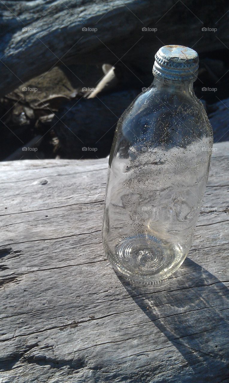 Glass Bottle. Discovered a sandy glass bottle on Washaway Beach