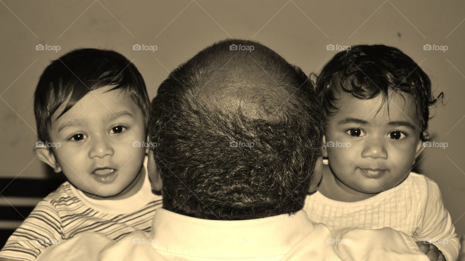 surprised babies and a bald head