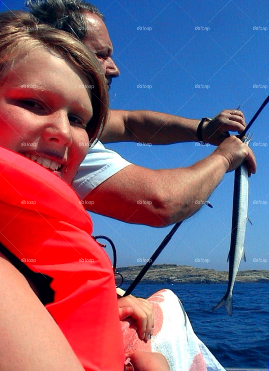 Fishing. A boy and his father fishing