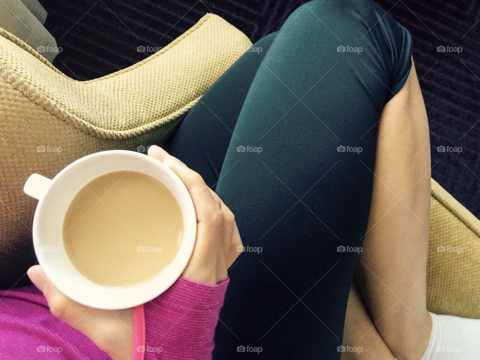 Cozy chair, coffee cup, cuddle spot. Waking up in the morning can be difficult. But with a cozy chair and coffee cup, active females don’t mind the routine, pre or post workout.