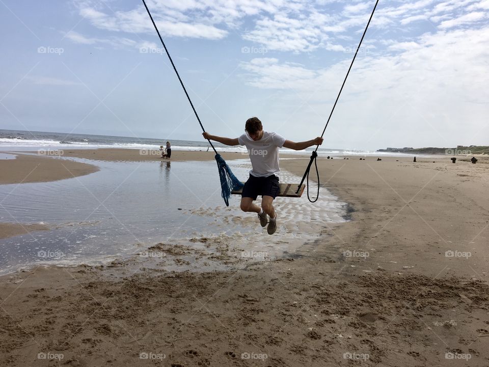 Enjoying a pop up swing at the beach … fixed to an old pier … 