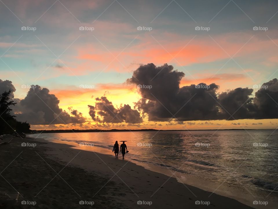 A sunset walk on the beach. 
