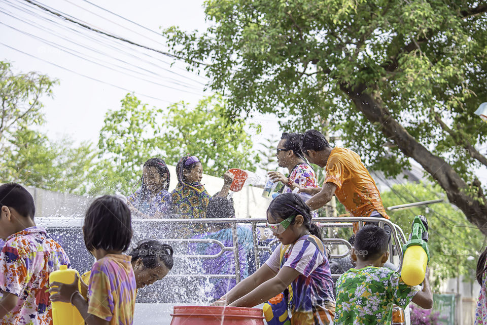 Tourists on the car play water in Songkran festival or Thai new year at Bang kruai, Nonthaburi , April 14, 2019