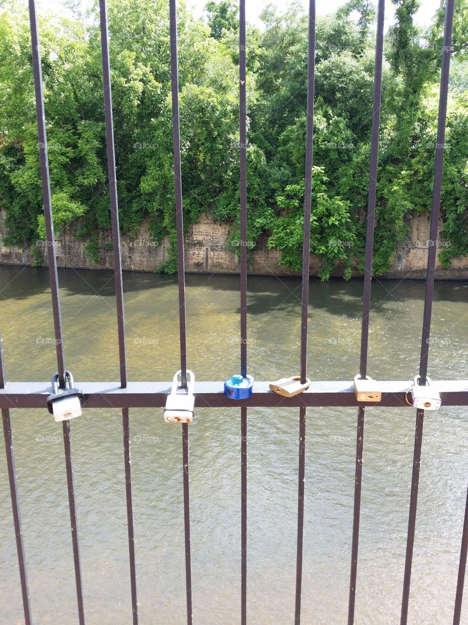 Romantic Lock & Key Promises. In this downtown park in Prattville, Alabama it is tradition that boyfriend and girlfriend place a lock on this fence overlooking the creek and each of them keep a key to representing the key to their heart.