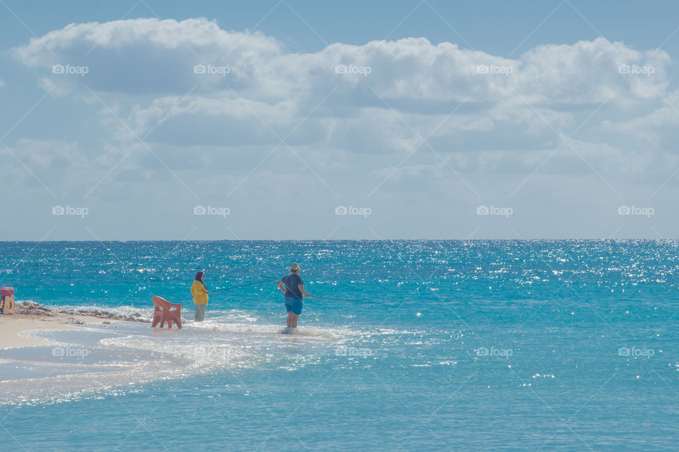People fishing by the beach