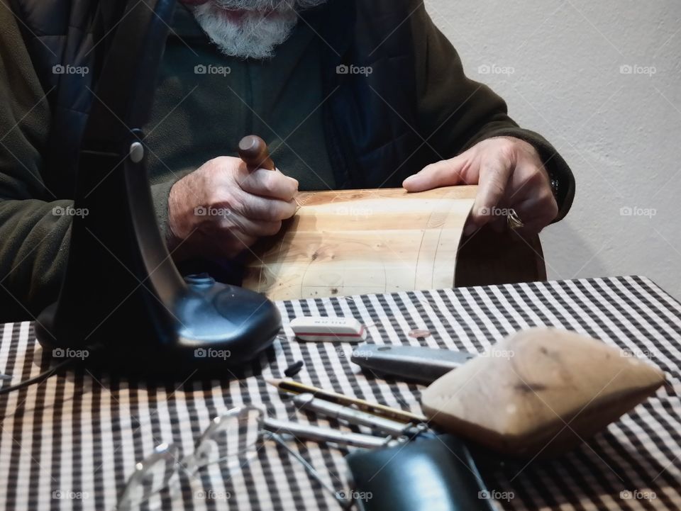 Man making local music instruments 