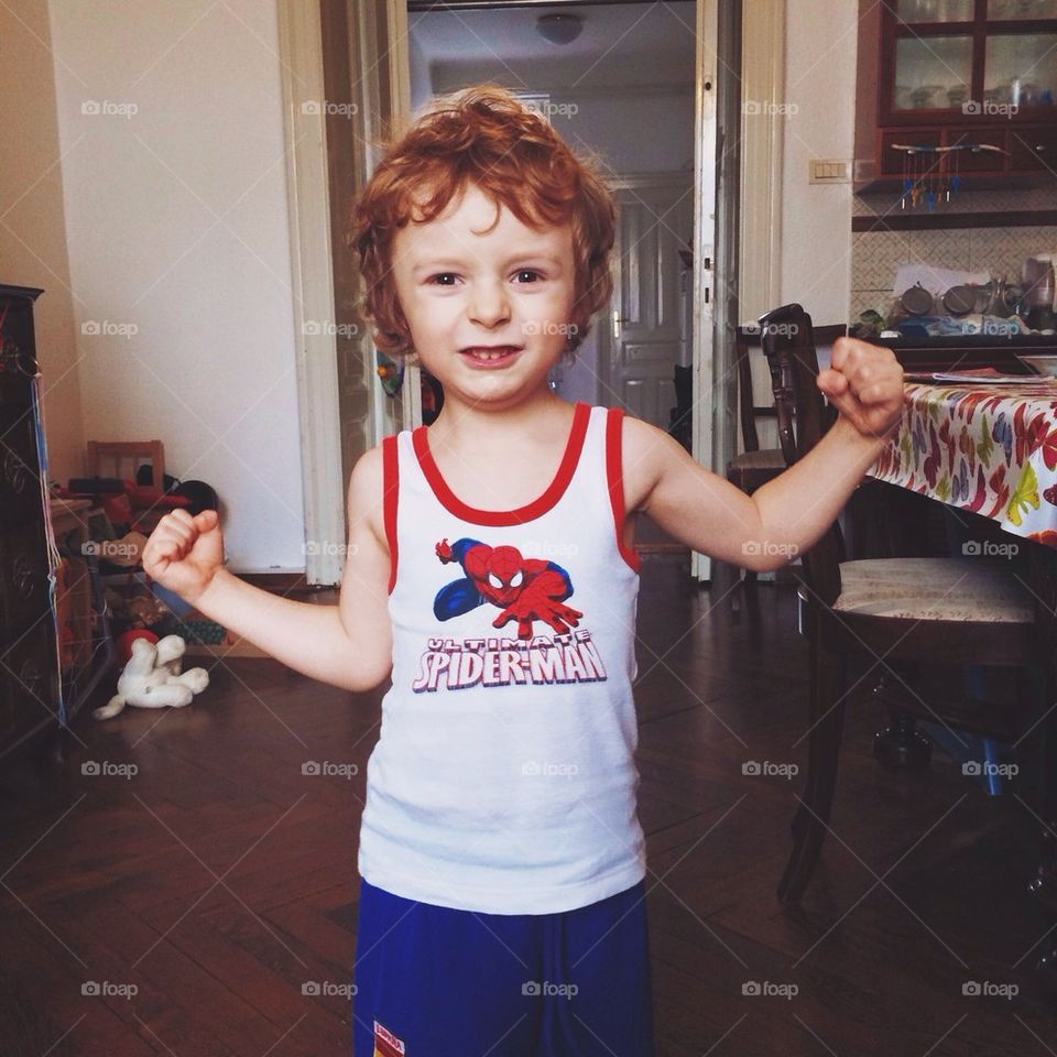 Boy showing muscles