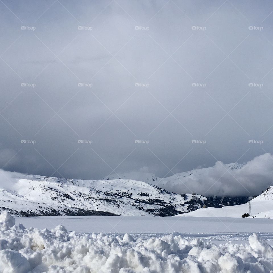 Snow and clouds in mountains 