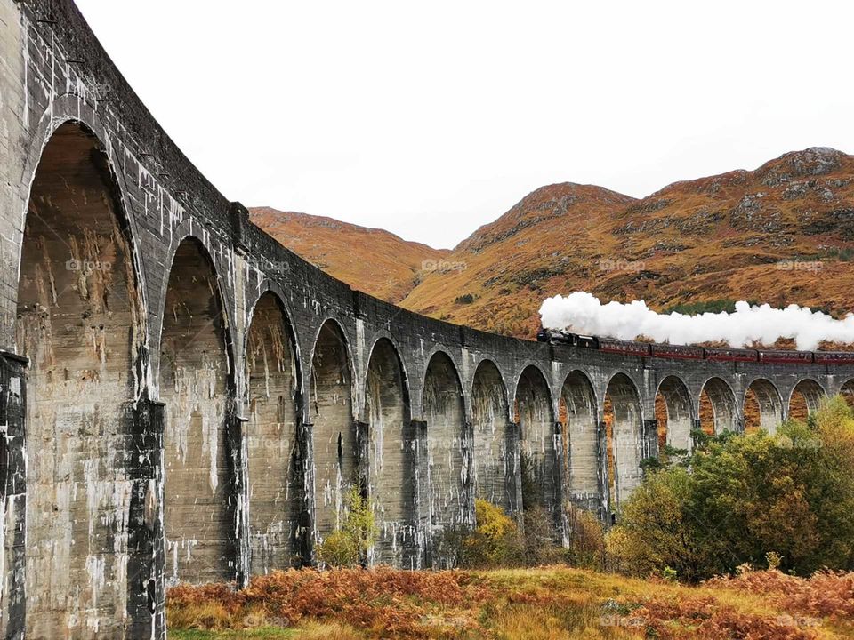 Jacobite steam train on glenfinnan viaduct