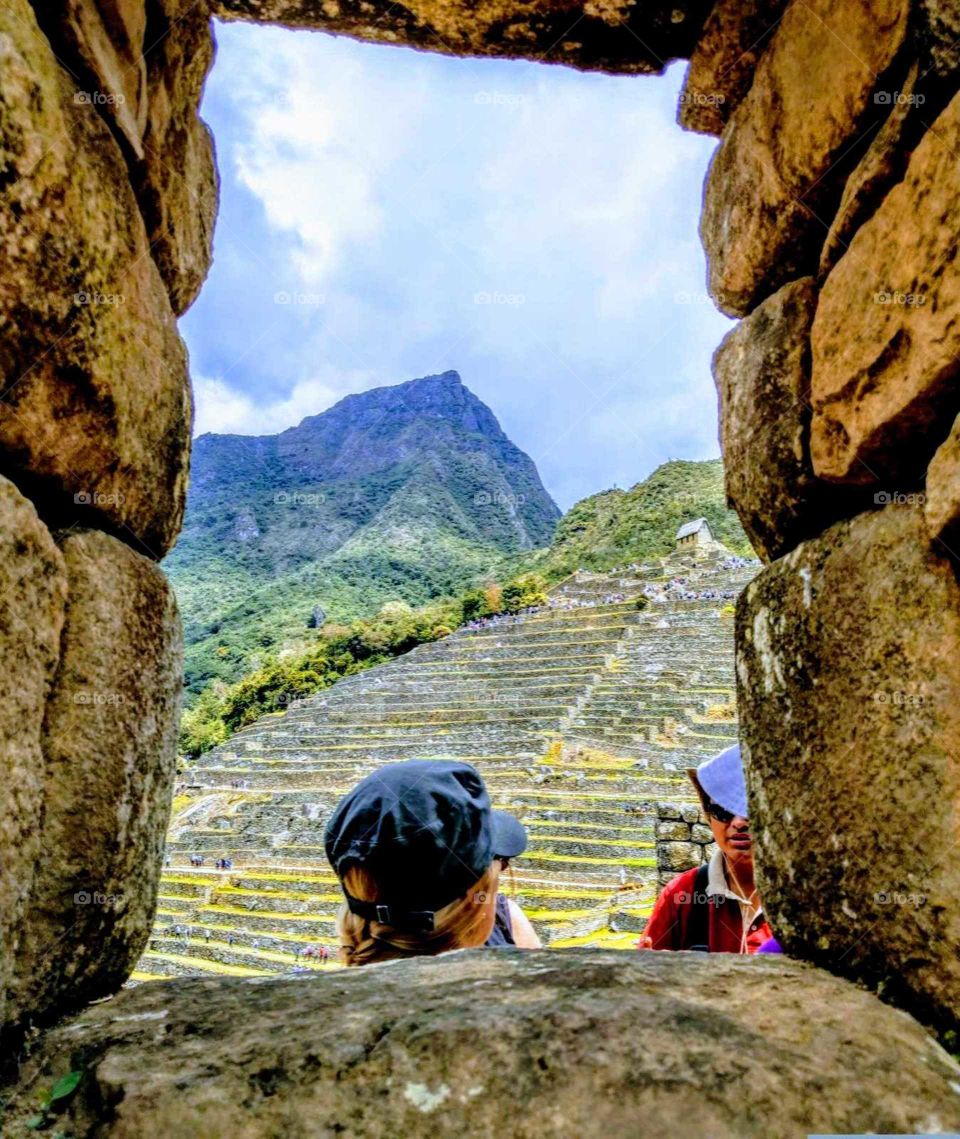 The art of composition: the landscape in the rock frame. incredible stone architecture in Machupichu, Peru. Amazing! Inca ancient civilization.