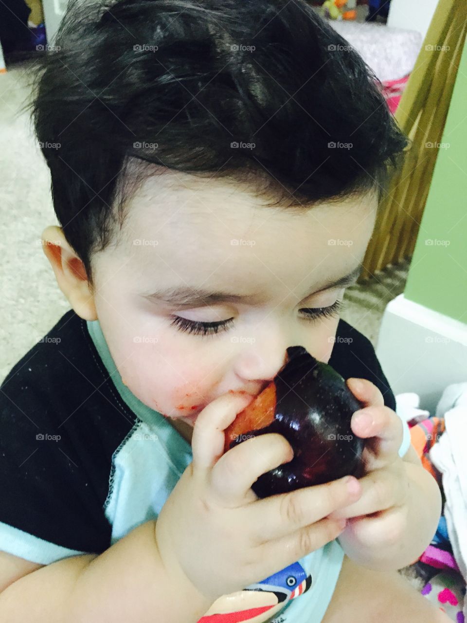 Baby eating fruit