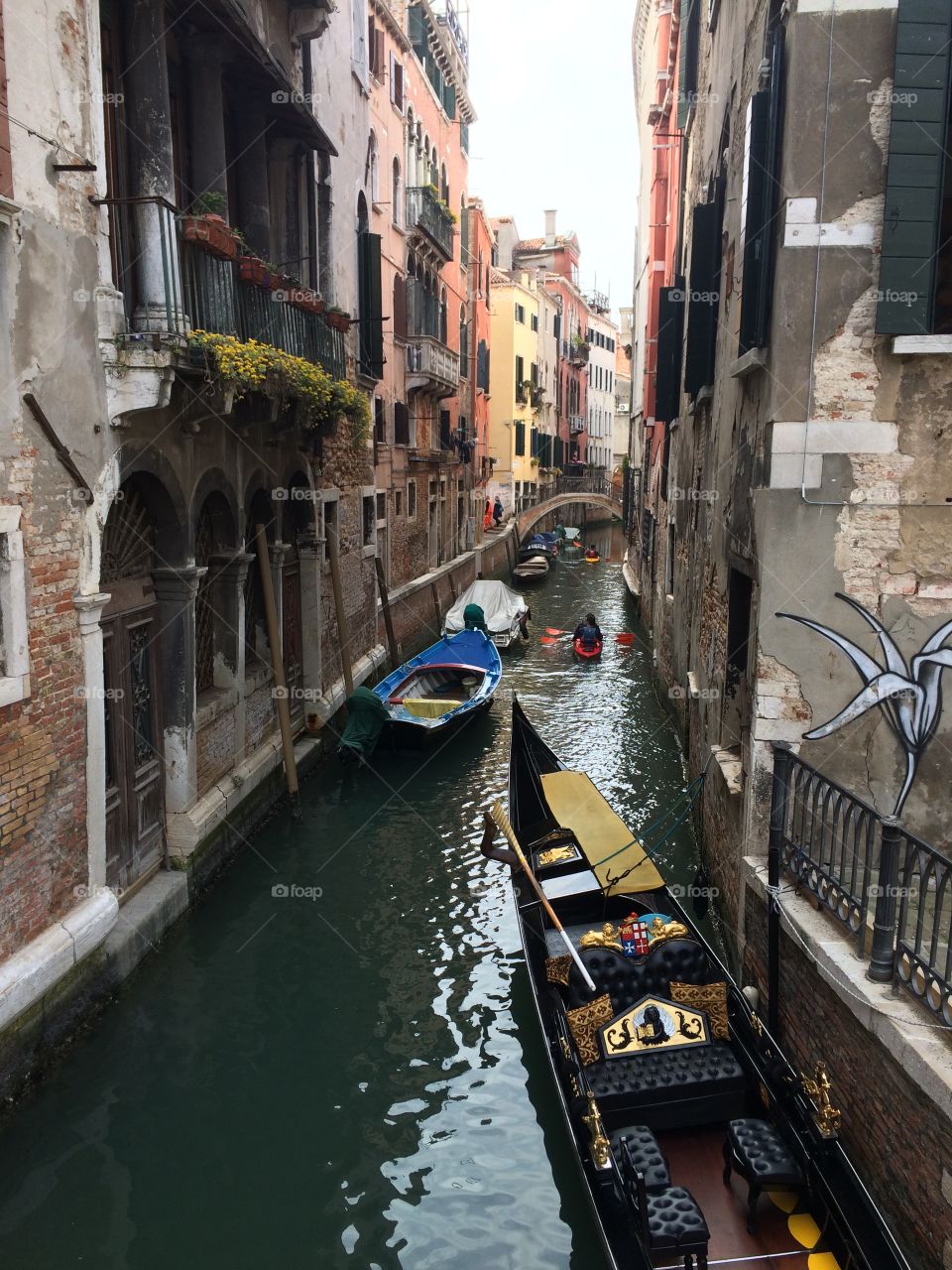 Venetian canal with graffiti 