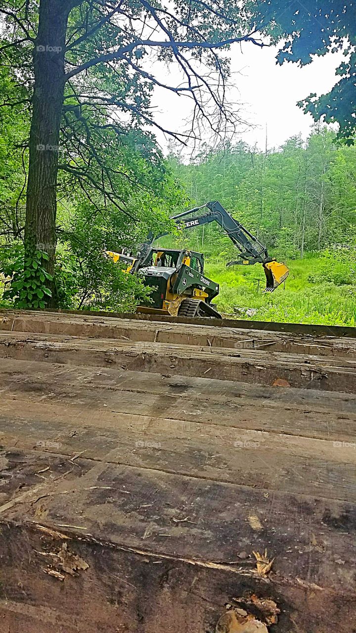 Excavator working on the power lines