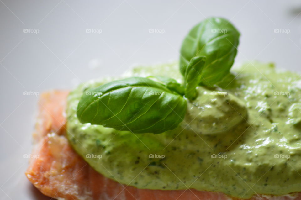 High angle view of pesto sauce and basil leaf