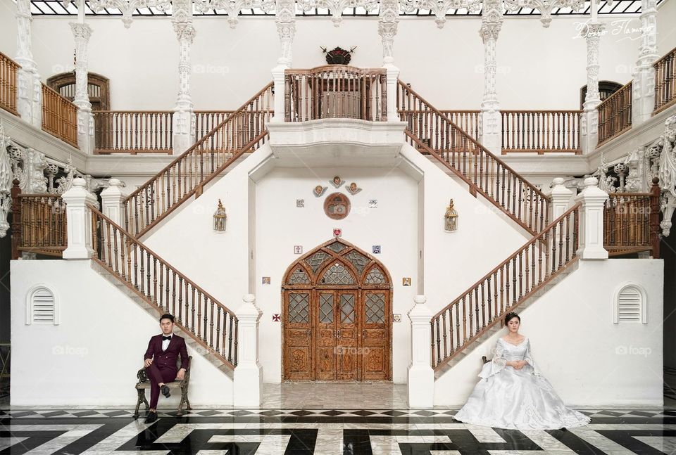 Wedding couple in ballroom vintage hall.