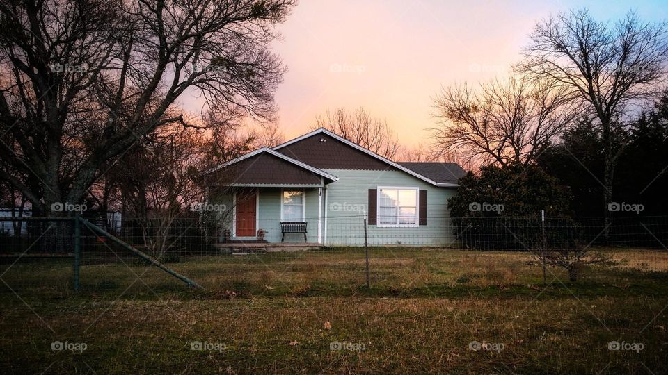 A remodeled 1900s farmhouse in East Texas at Sunrise