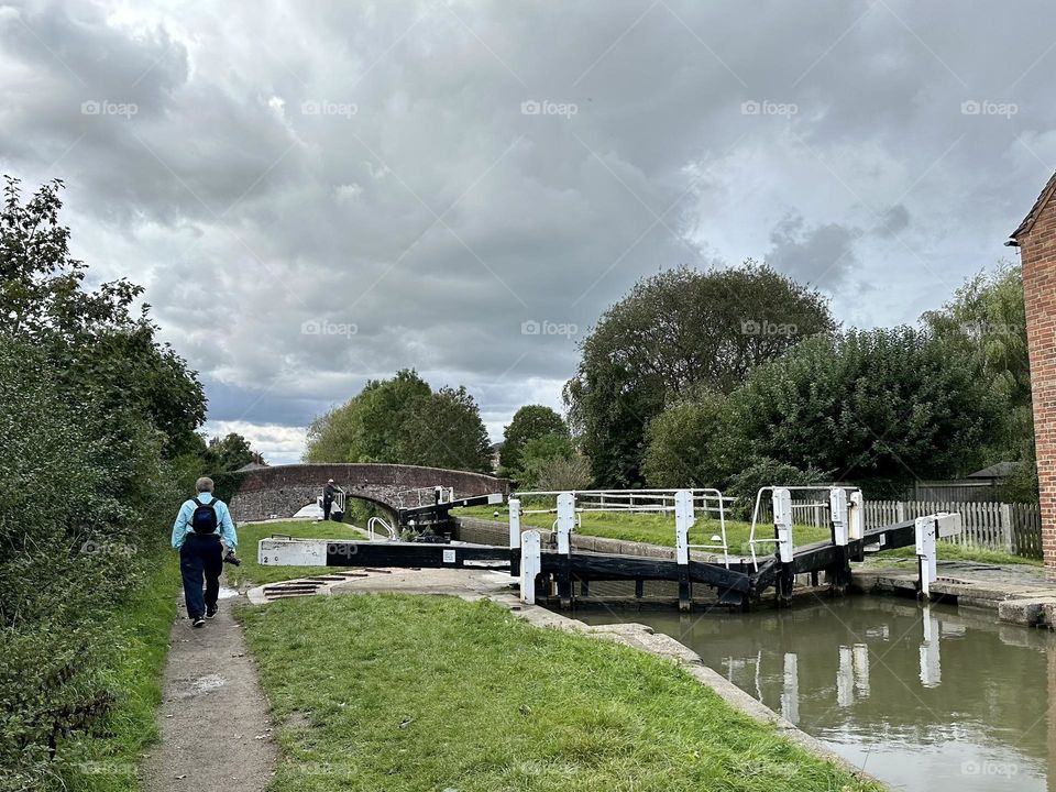 Father walking along the towpath near the Braunston locks canal life England Father’s Day summer vacation cloudy sky