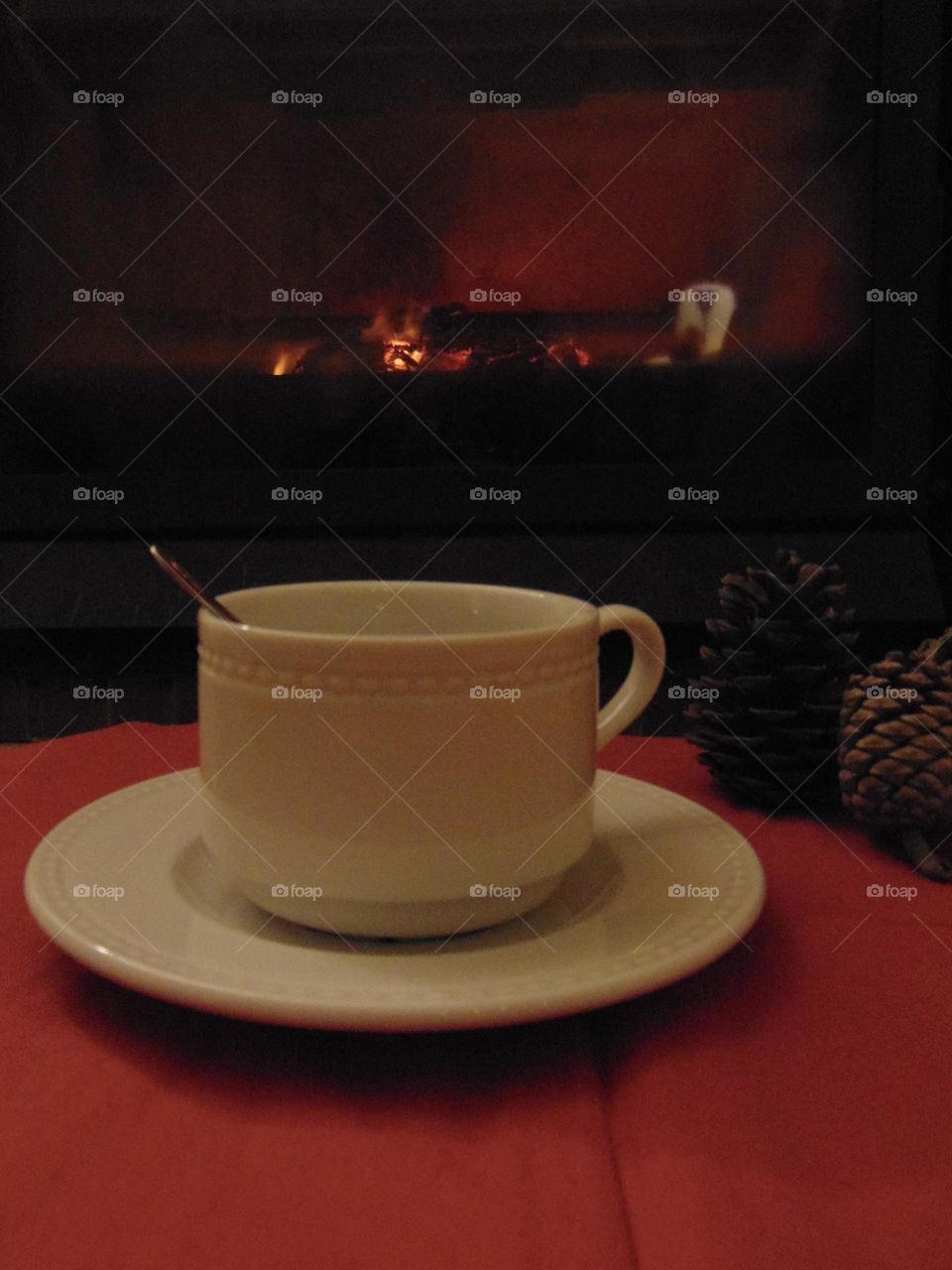 A cup of tea near the fireplace 
