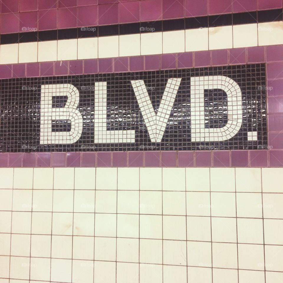 Subway tile blvd. White black and purple tiles. 