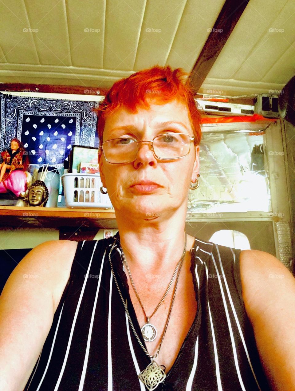 Elegantly dressed in a black & white vertical stripe motif  I am trying to stay cool for the summer sans air conditioning aboard „Salvation“, our „28 foot 1969 Luhrs“ cabin cruiser. Staying as still as possible is the idea. 2019. Hypnotic Productions