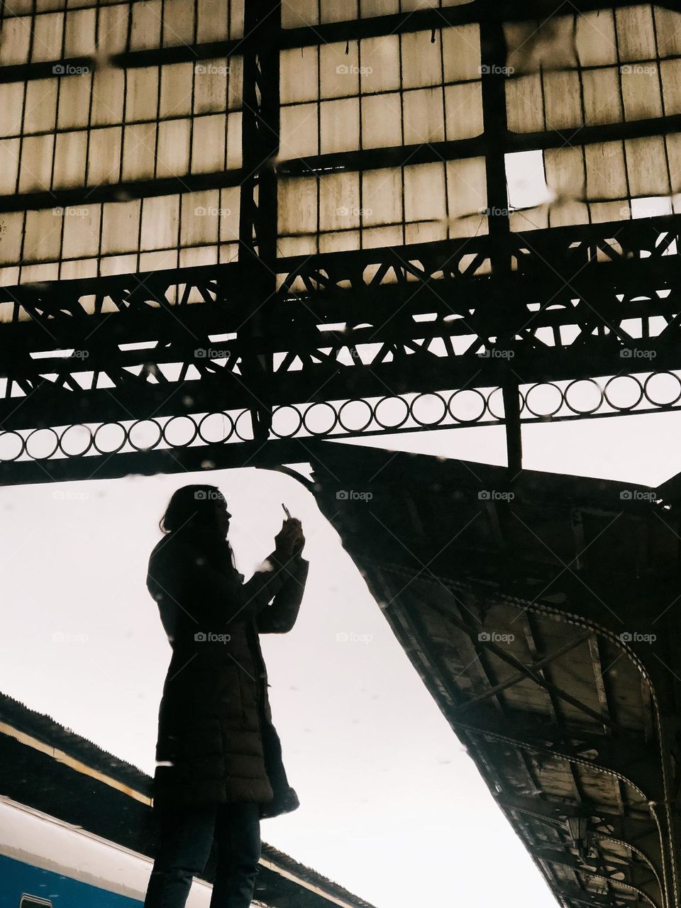 Reflection of woman in rainy day