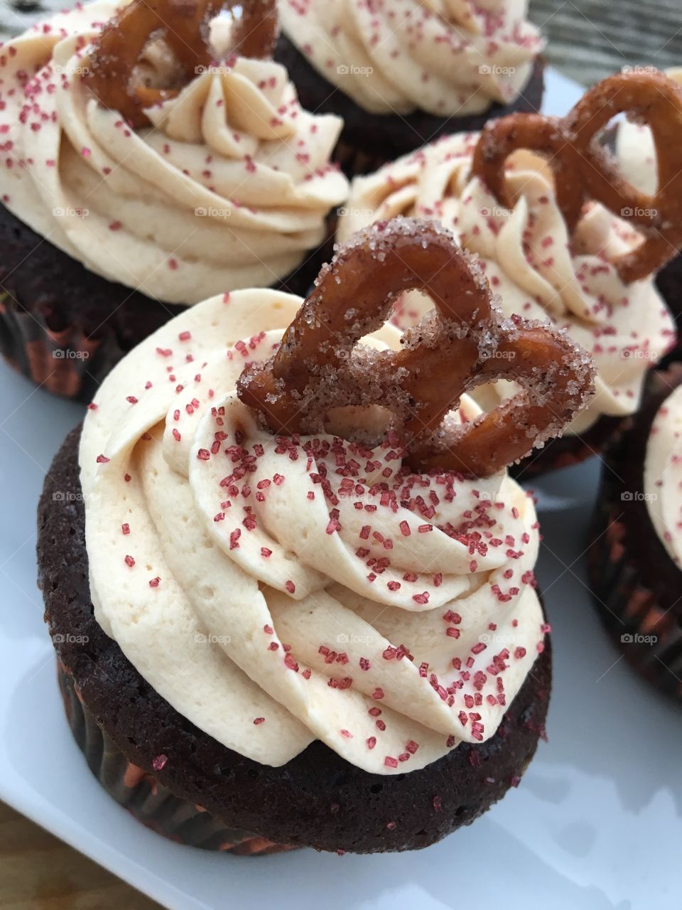 Milk Chocolate Cupcake with Caramel Buttercream with Cinnamon Sugar Pretzel 