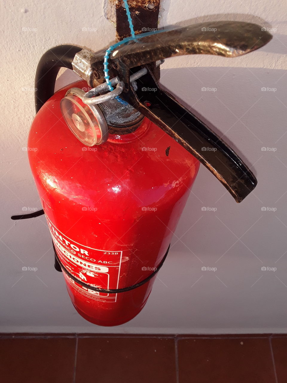 fire extinguisher attached to the wall