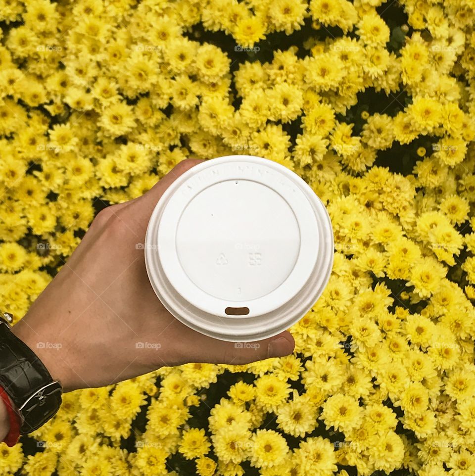 Coffee over flowers