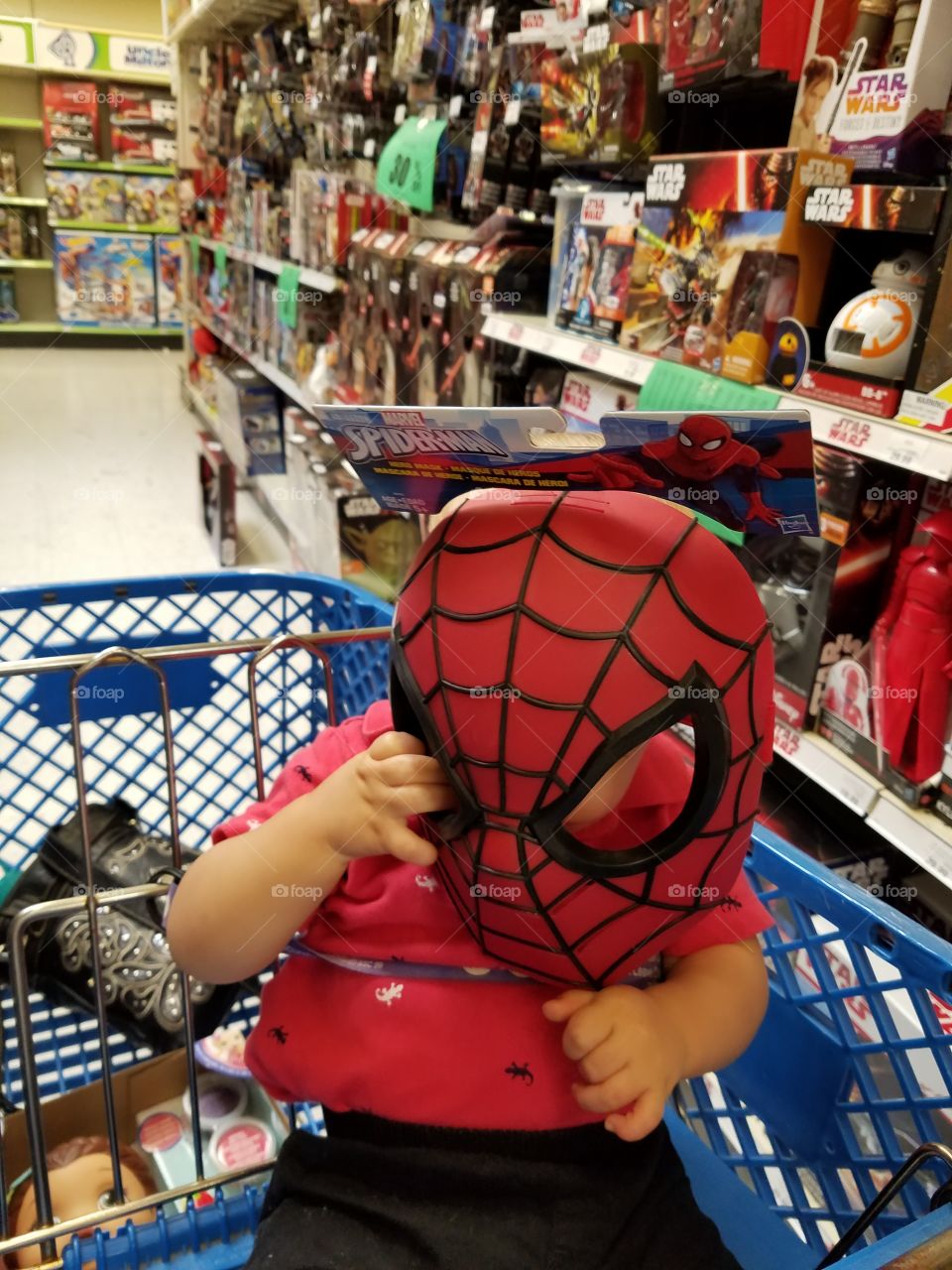 trying on the spider man mask