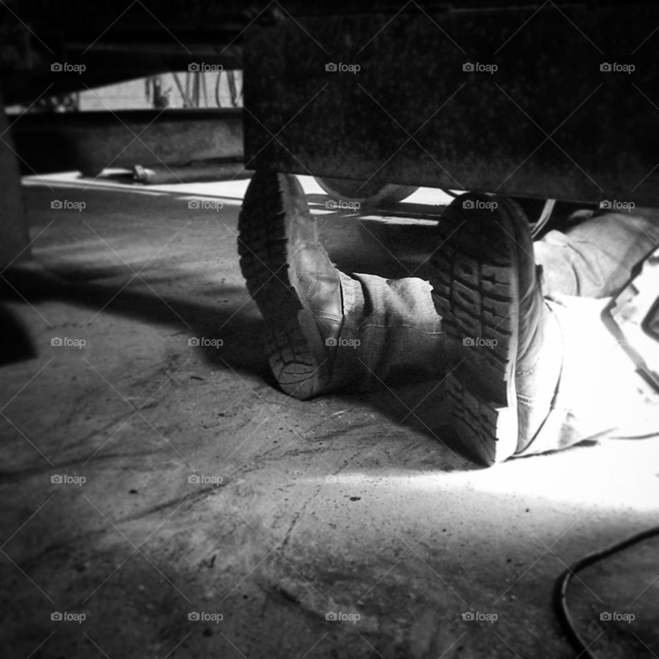 workin for a livin. my brother's boots while her works on his truck