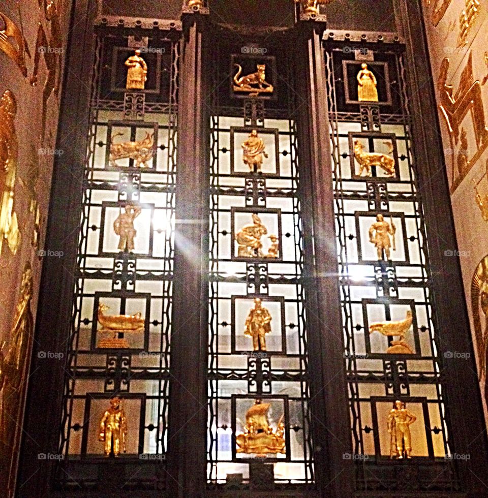 Ornate black and gold door.