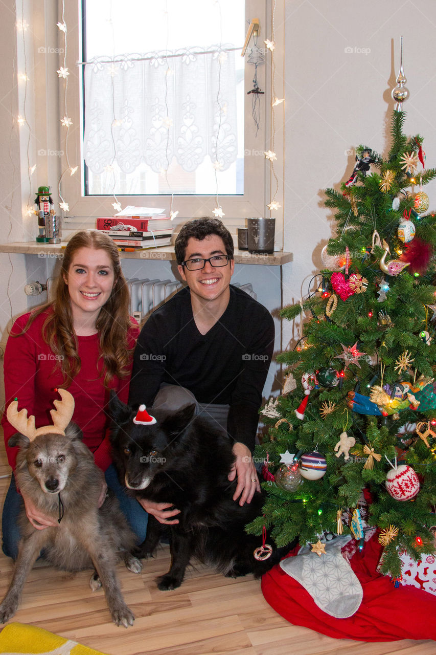 Family photo by the Christmas tree 