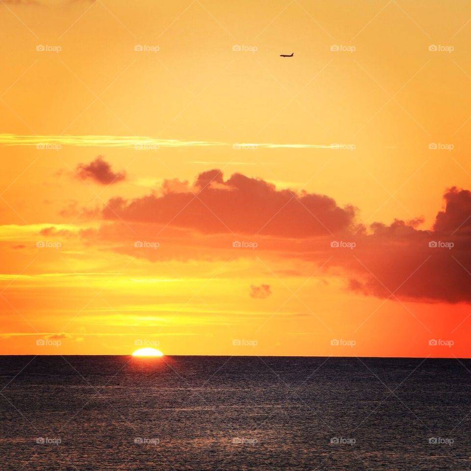 plane over sunset