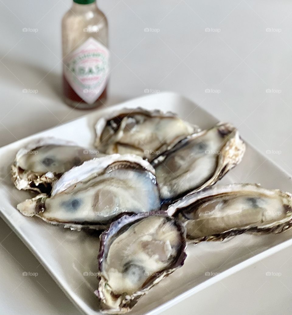 Half a dozen Freshly shucked Japanese oysters with tobacco sauce 