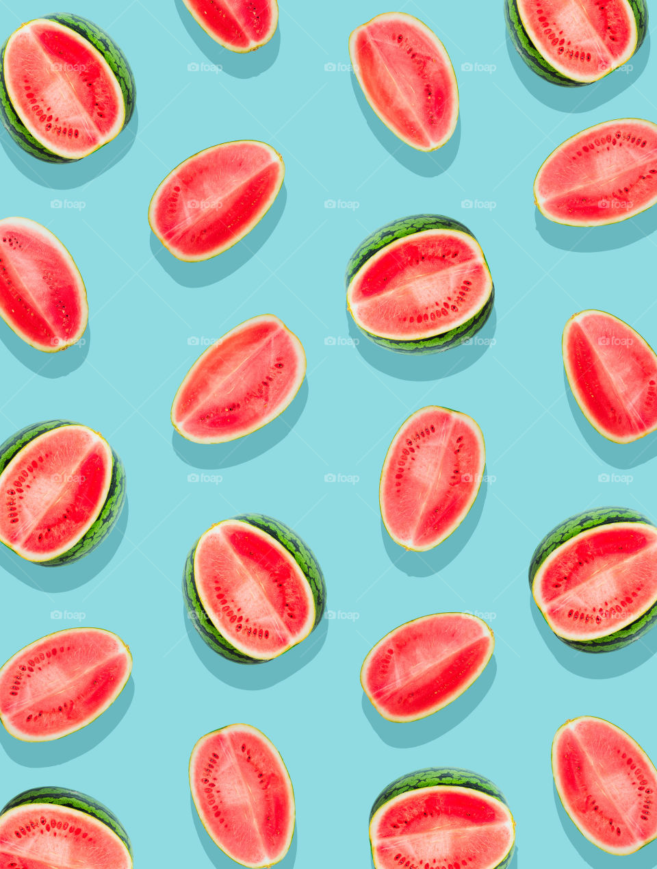 Watermelon pattern. Slices of watermelon on a surface painted in bright blue