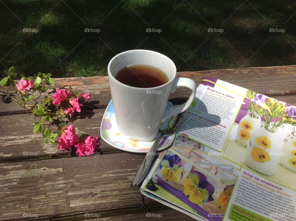 Enjoying a cup of coffee on a beautiful spring day outdoors.