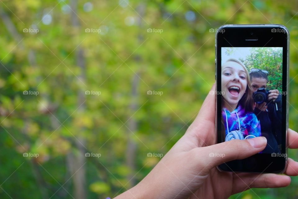 Woman taking selfie in mobile phone