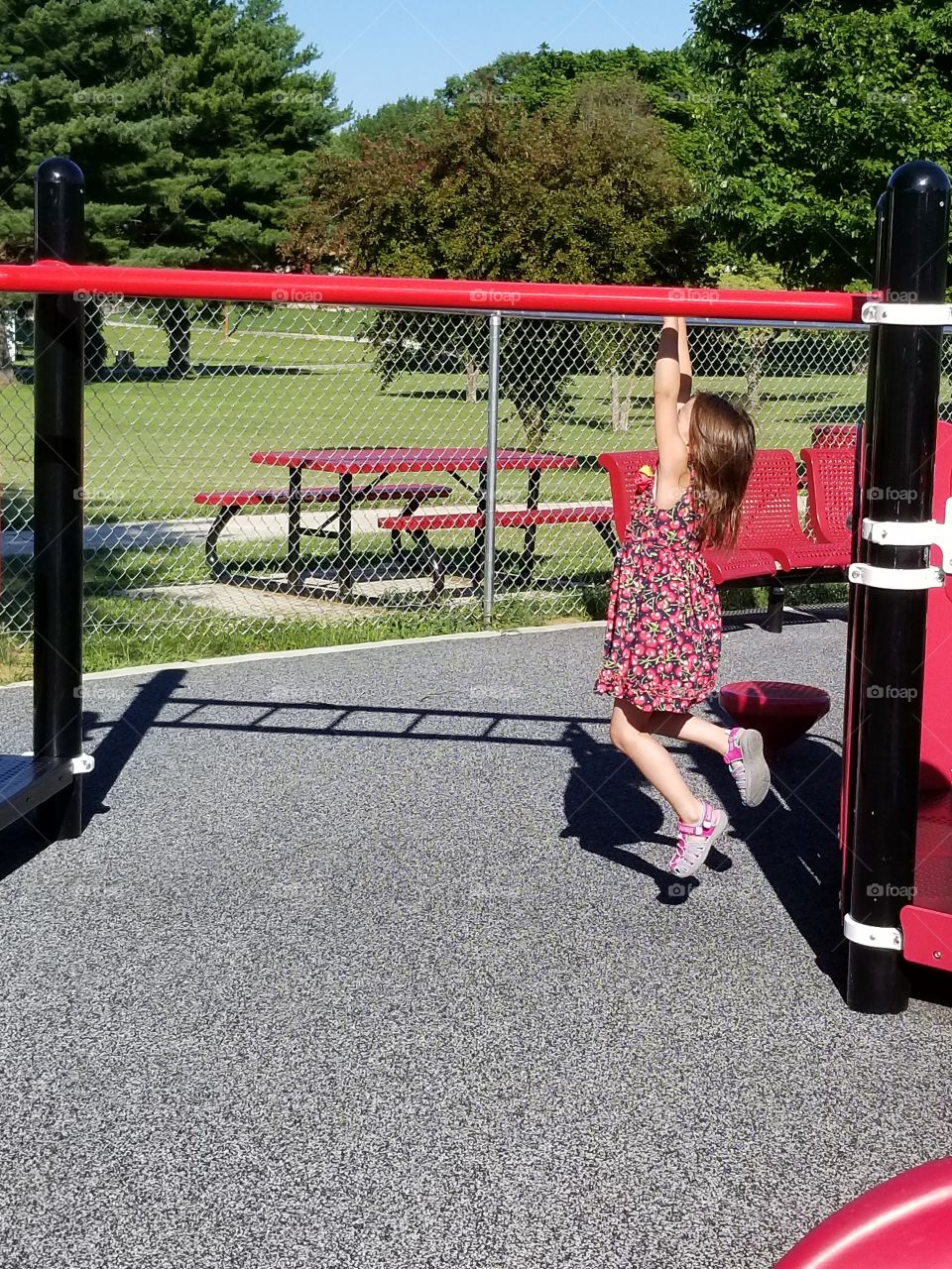 small child on monkey bars