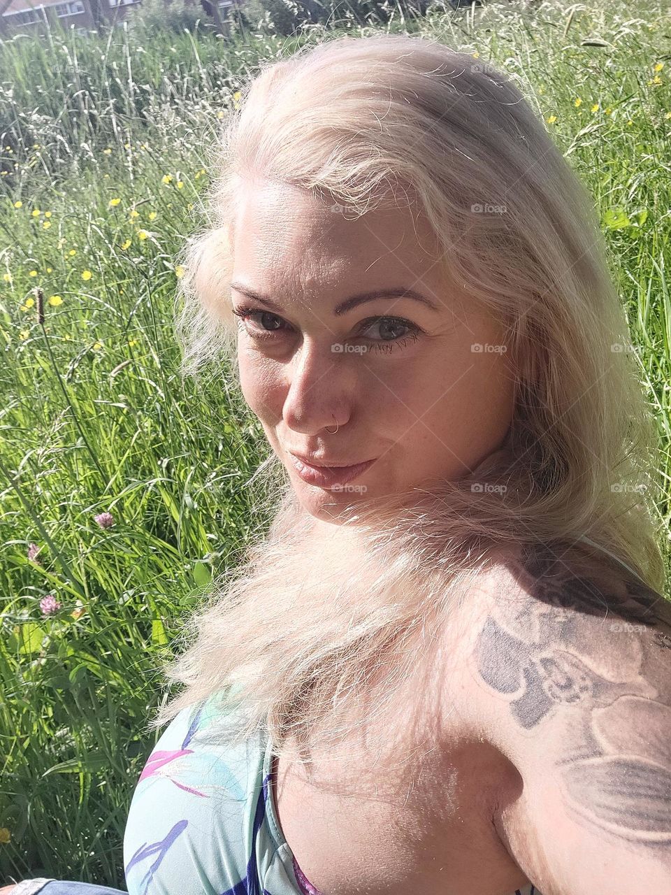 blond woman headshoot green nature