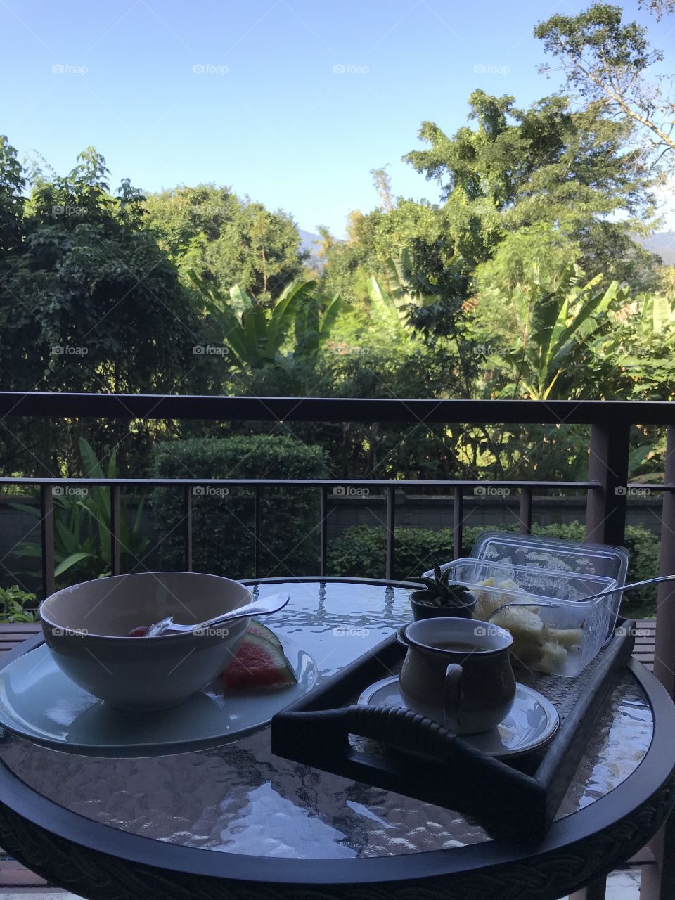 Breakfast on the balcony. Sitting at home, Chiang Mai, Thailand. 