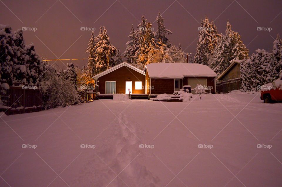 View of houses on snowy landscape