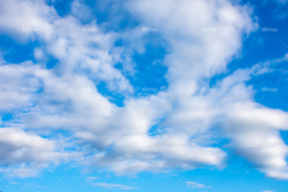 The beauty of the sky with clouds and the sun.