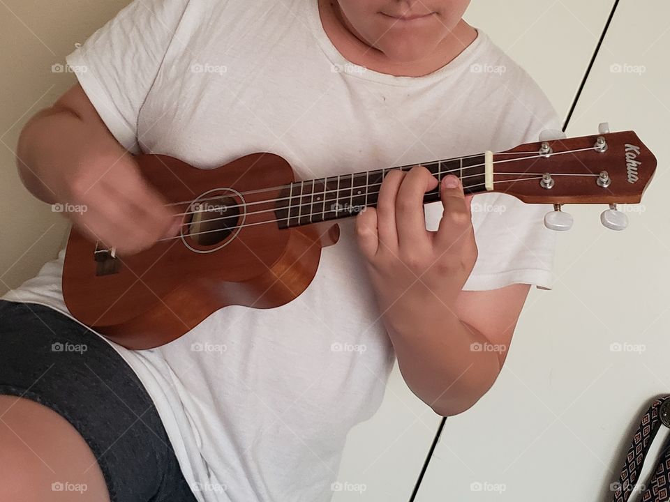 playing a ukelele