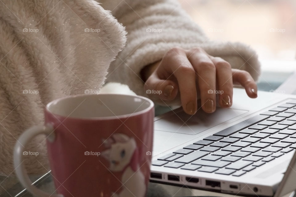 Girl working on laptop at home