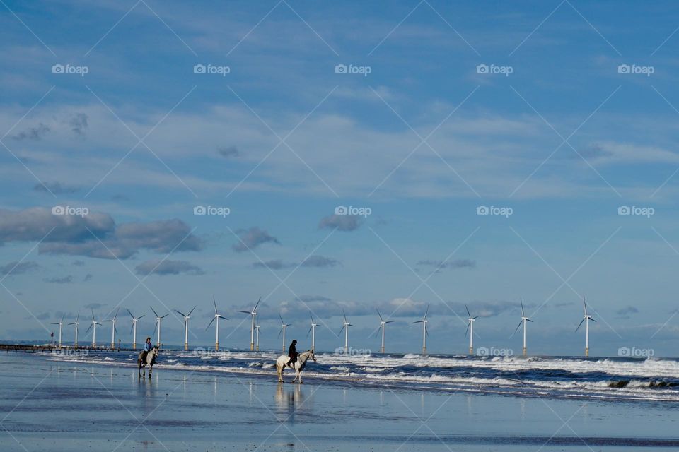 Minimalistic photo … showing wind turbines out to sea 