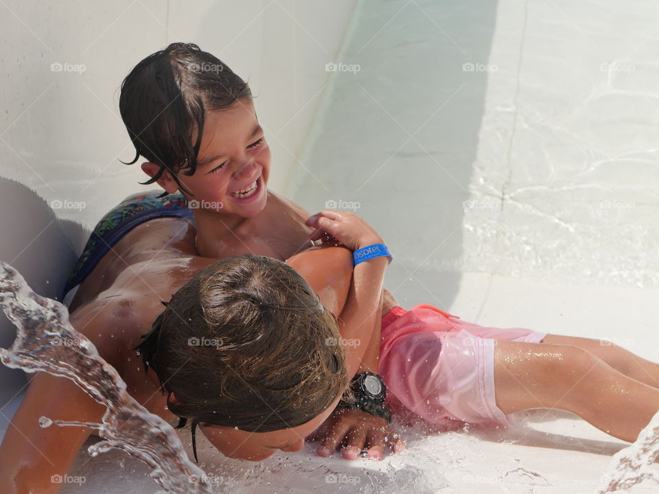 laughing playing with water