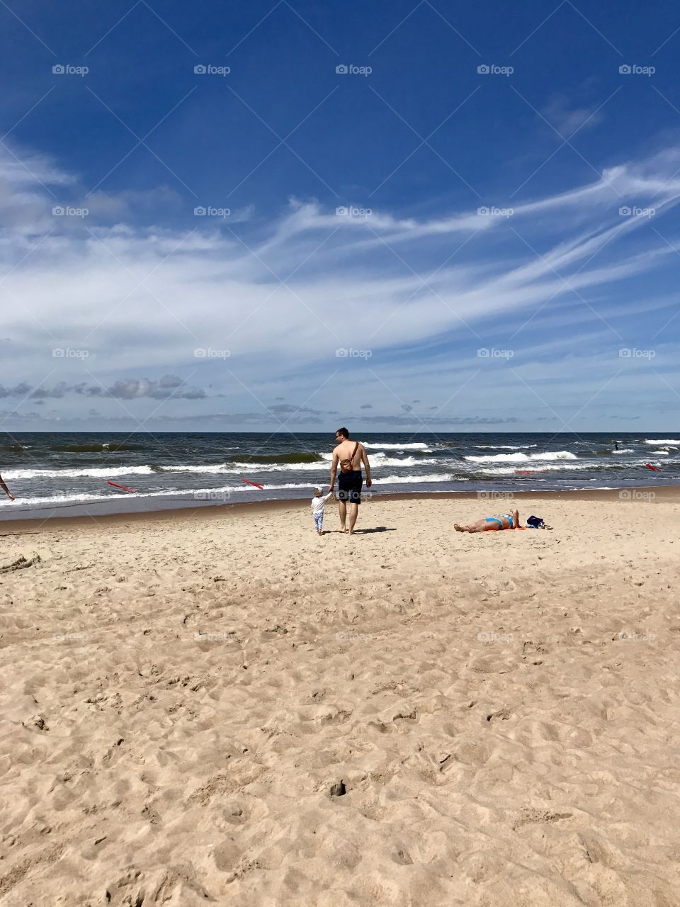 Father and child near the sea 