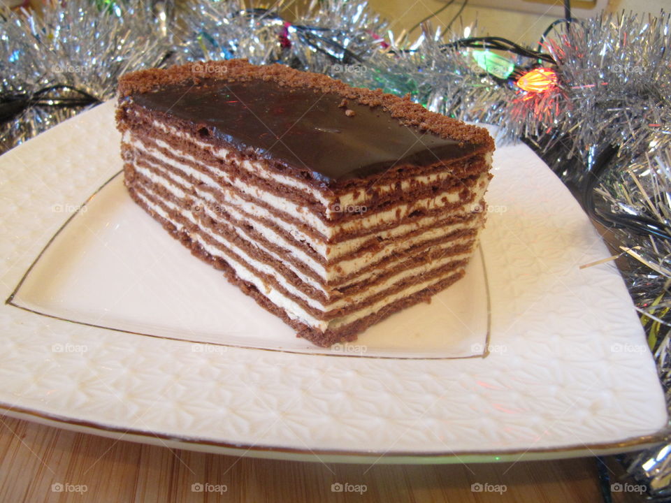 Chocolate Spartak cake on the white plate