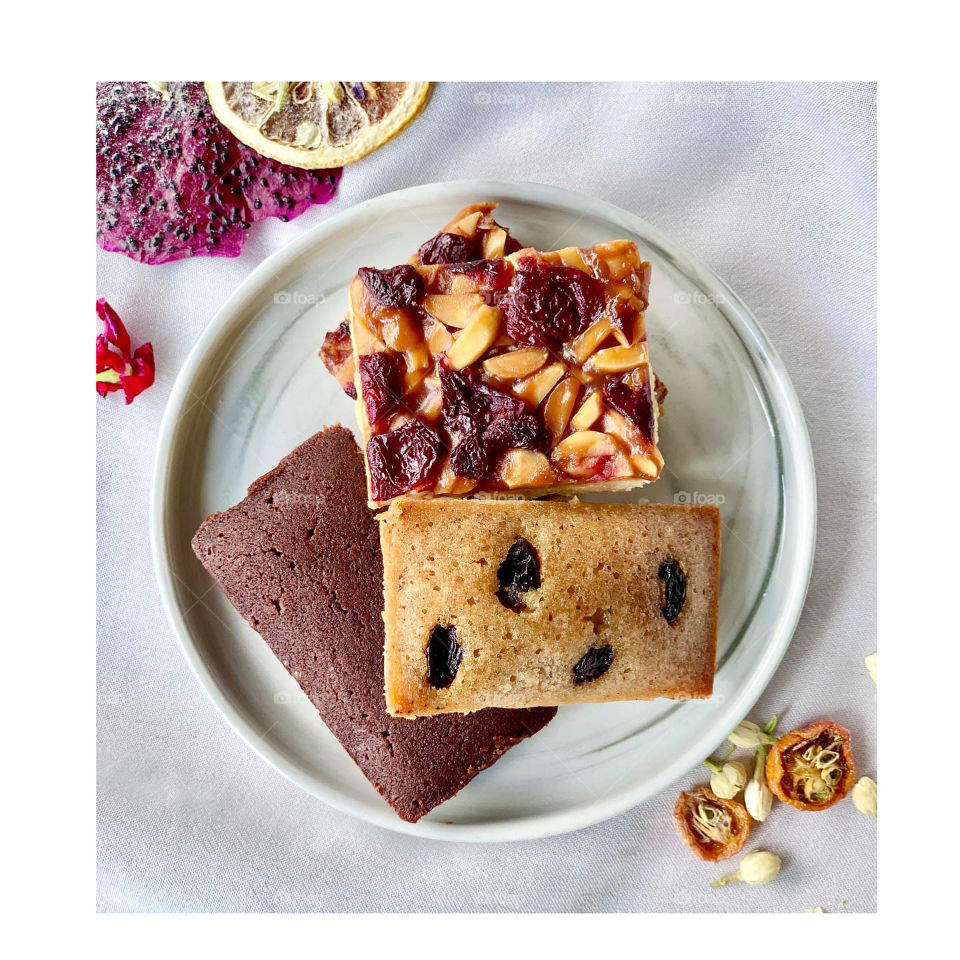Cherry almond shortbread with cashew raisin and chocolate financiers 