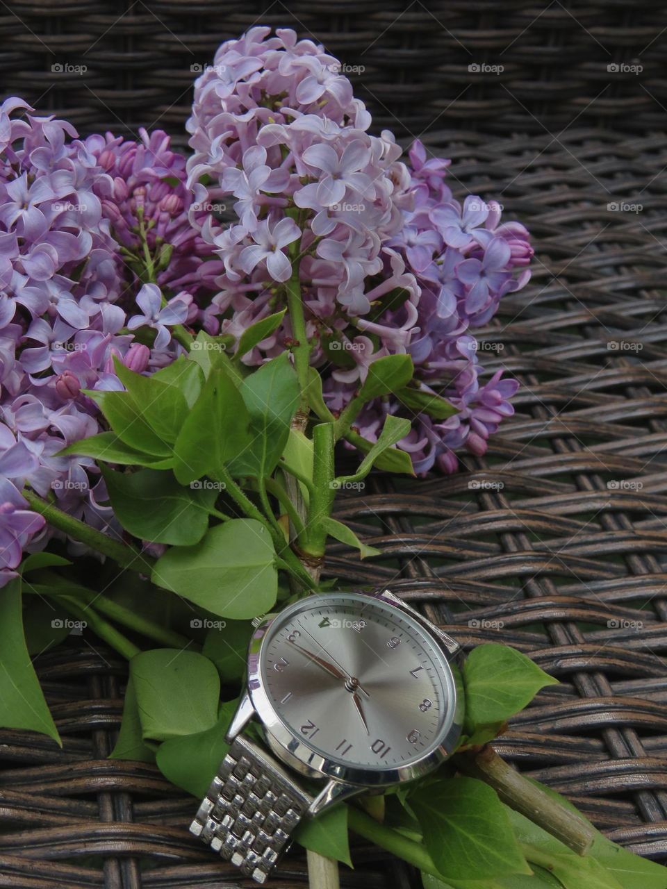 Bouquet of Lilacs and a Silver Watch